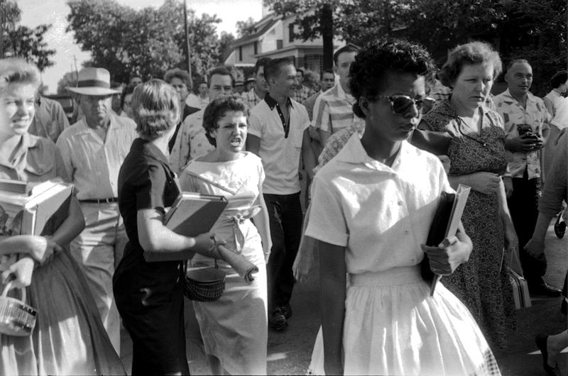 Elizabeth Eckford, followed by an angry crowd after she was denied entrance to Little Rock Central High School, September 4, 1957. The girl in the light dress behind her is Hazel Bryan.